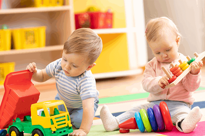 children play with toys in the nursery