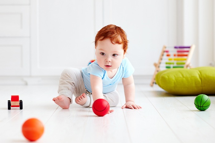 the child is playing with balls