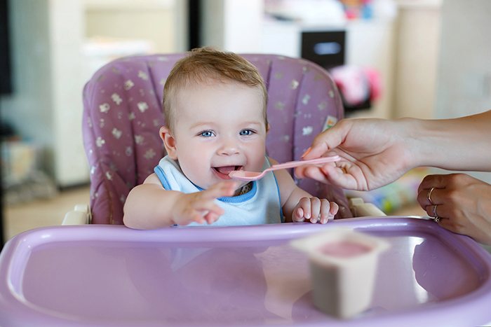 child eating dessert