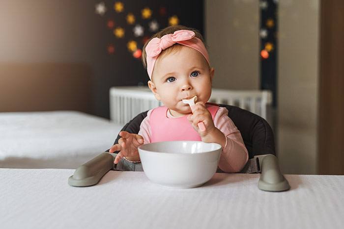 child eating porridge_0