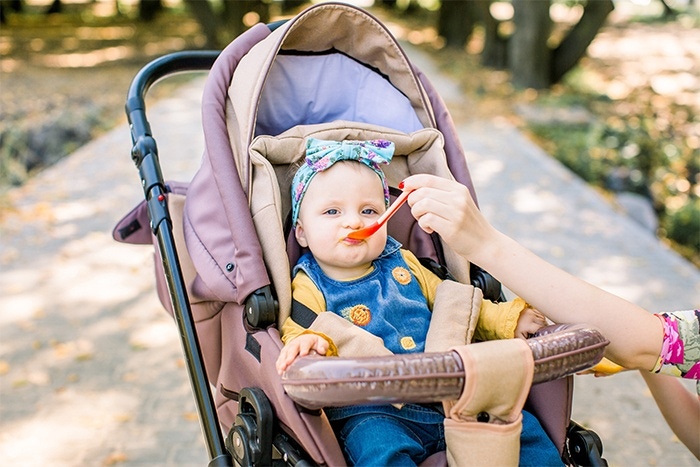 child on a walk with dessert