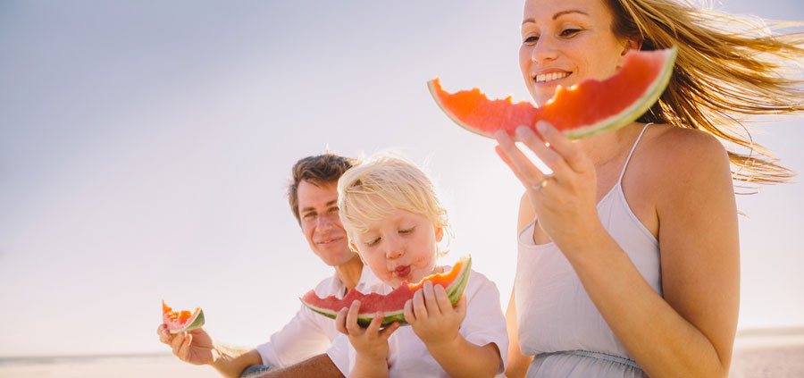 Family eating watermelon