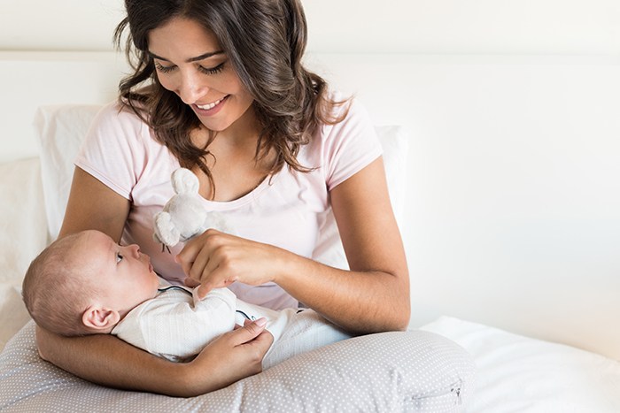 mom entertaining her baby