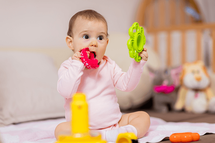 babies playing with toys