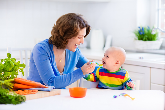 mother feeding the baby