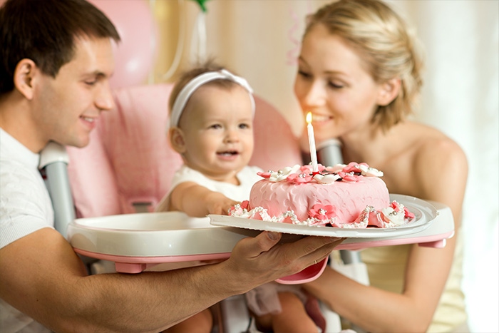 family celebrate birthday baby