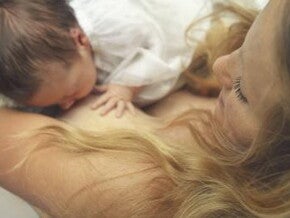 mother breastfeeding the baby