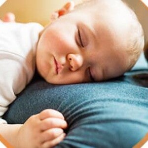 Baby and dad sleeping together