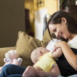 happy mother sitting breastfeeding happy mother sitting breastfeeding
