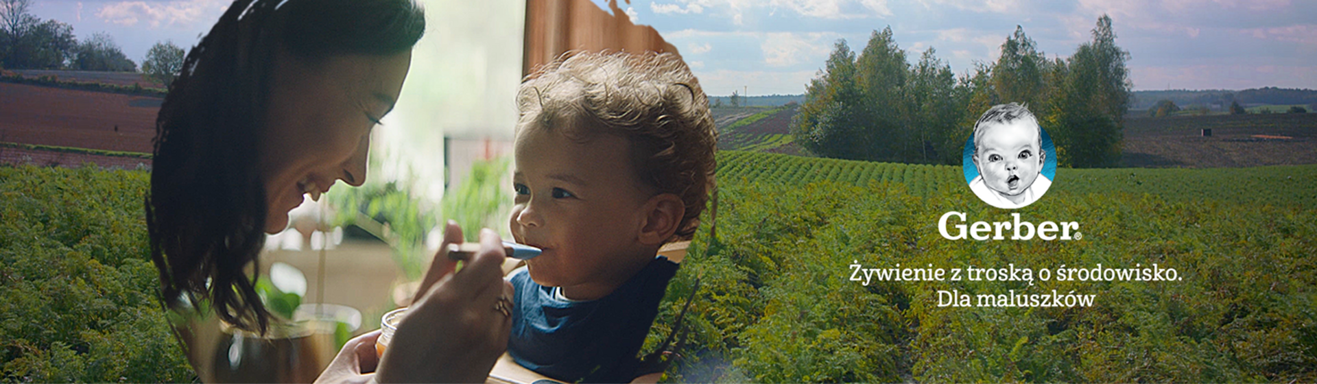Mother feeding child in sunlit room; Gerber logo overlay on scenic farm backdrop.