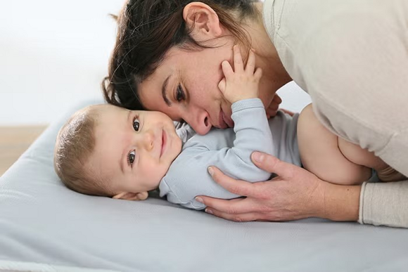 mom hugging her baby