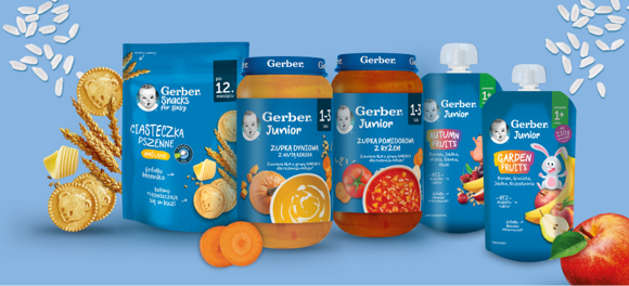 Zestaw produktów Gerber Junior: zupki, ciasteczka pszenne i musy owocowe na niebieskim tle z warzywami.