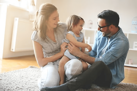 parents are playing with the child parents are playing with the child